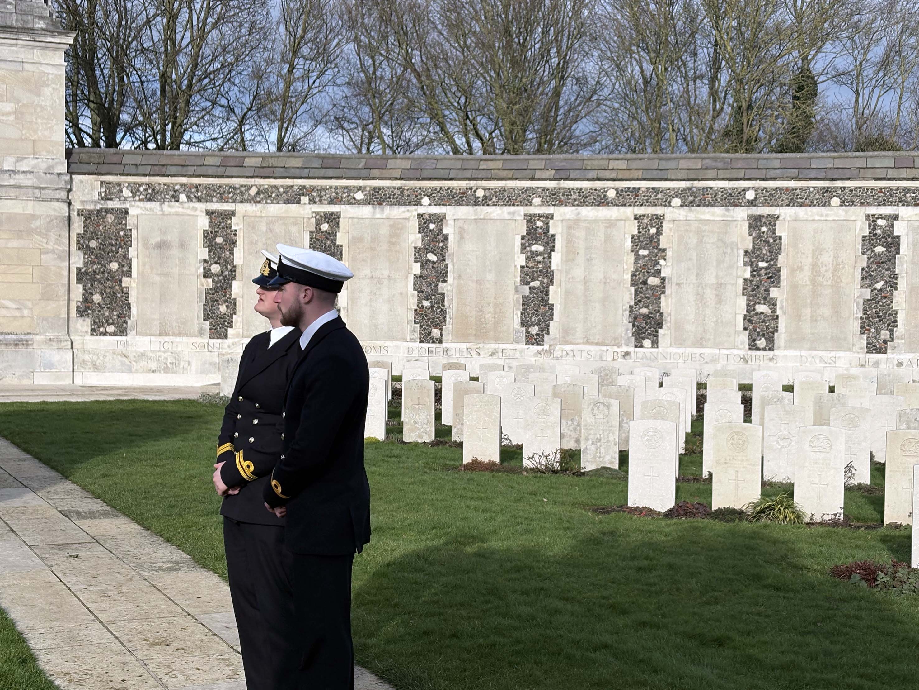 Lieutenant Payne and Sub Lieutenant Bolton pause to reflect at Tyne Cot