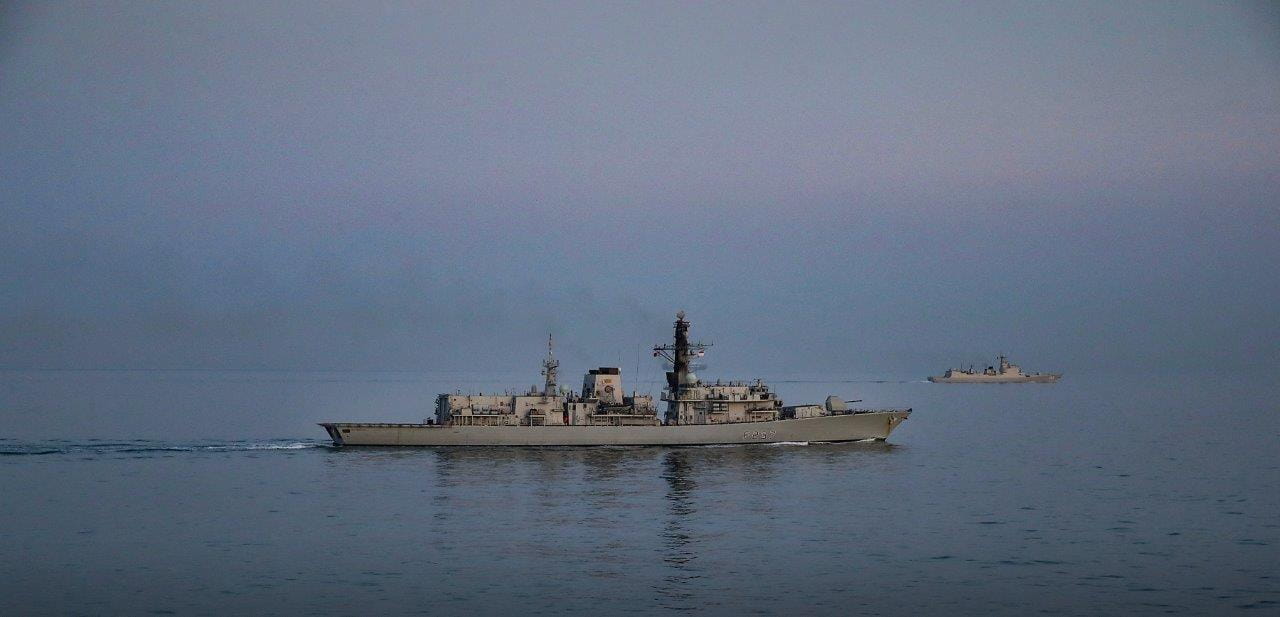 HMS Westminster (foreground) escorts the Chinese destroyer Xian