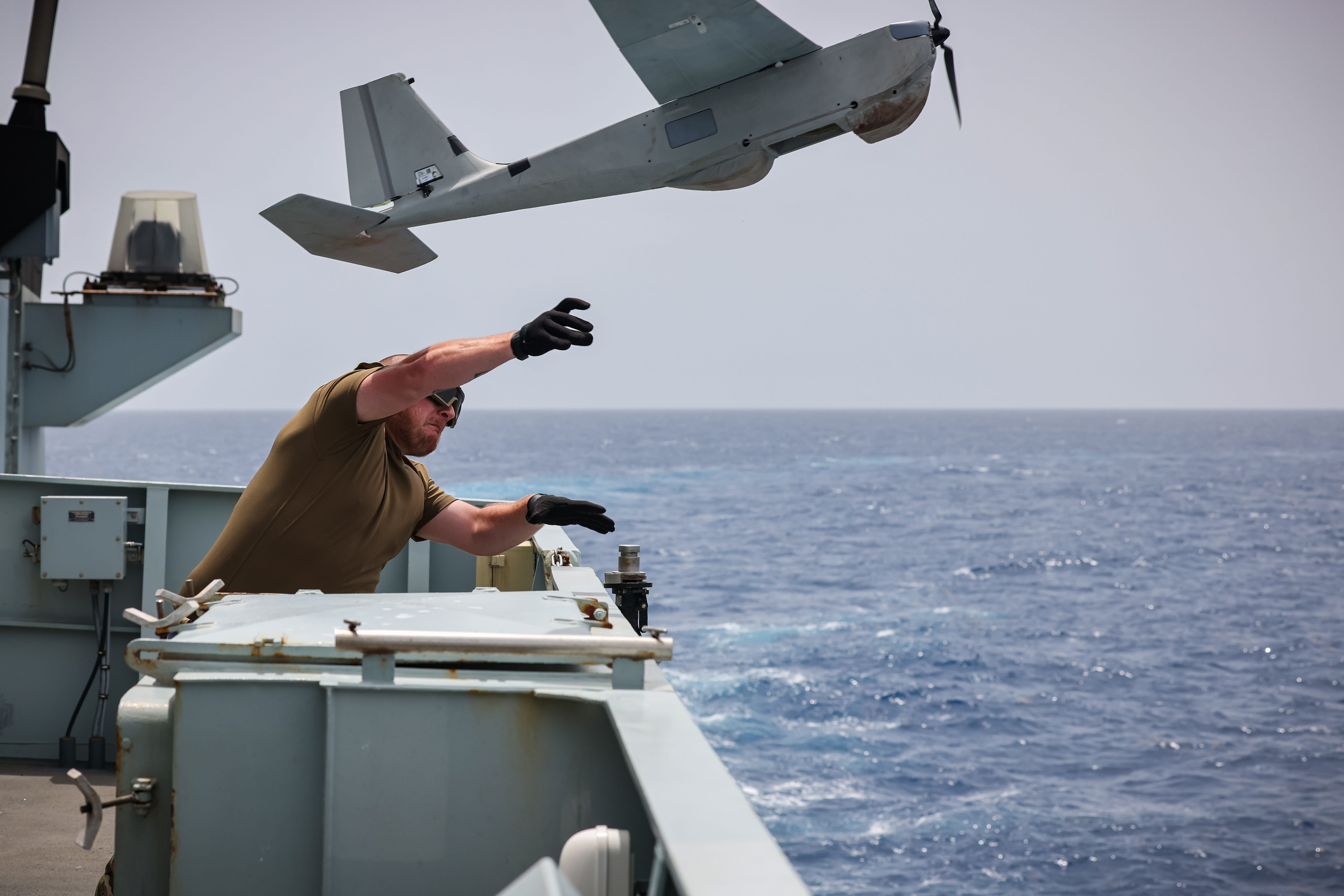 700X Naval Air Squadron personnel launch a Puma drone from HMS Trent while on patrol in the Caribbean in the summer of 2024
