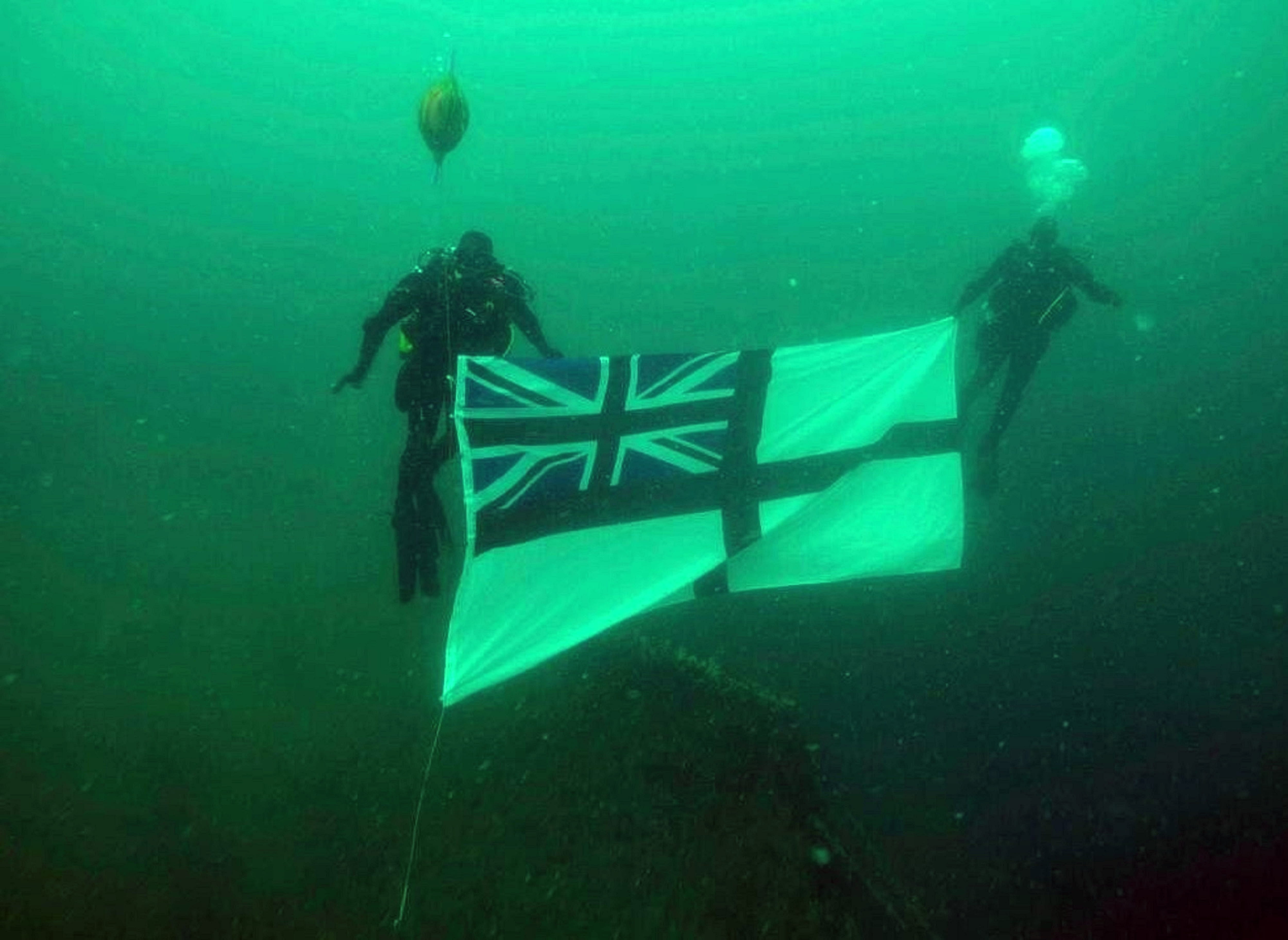 Northern Diving Group divers replace the White Ensign on the wreck of HMS Royal Oak.jpg Northern Diving Group divers replace the White Ensign on the wreck of HMS Royal Oak.jpg