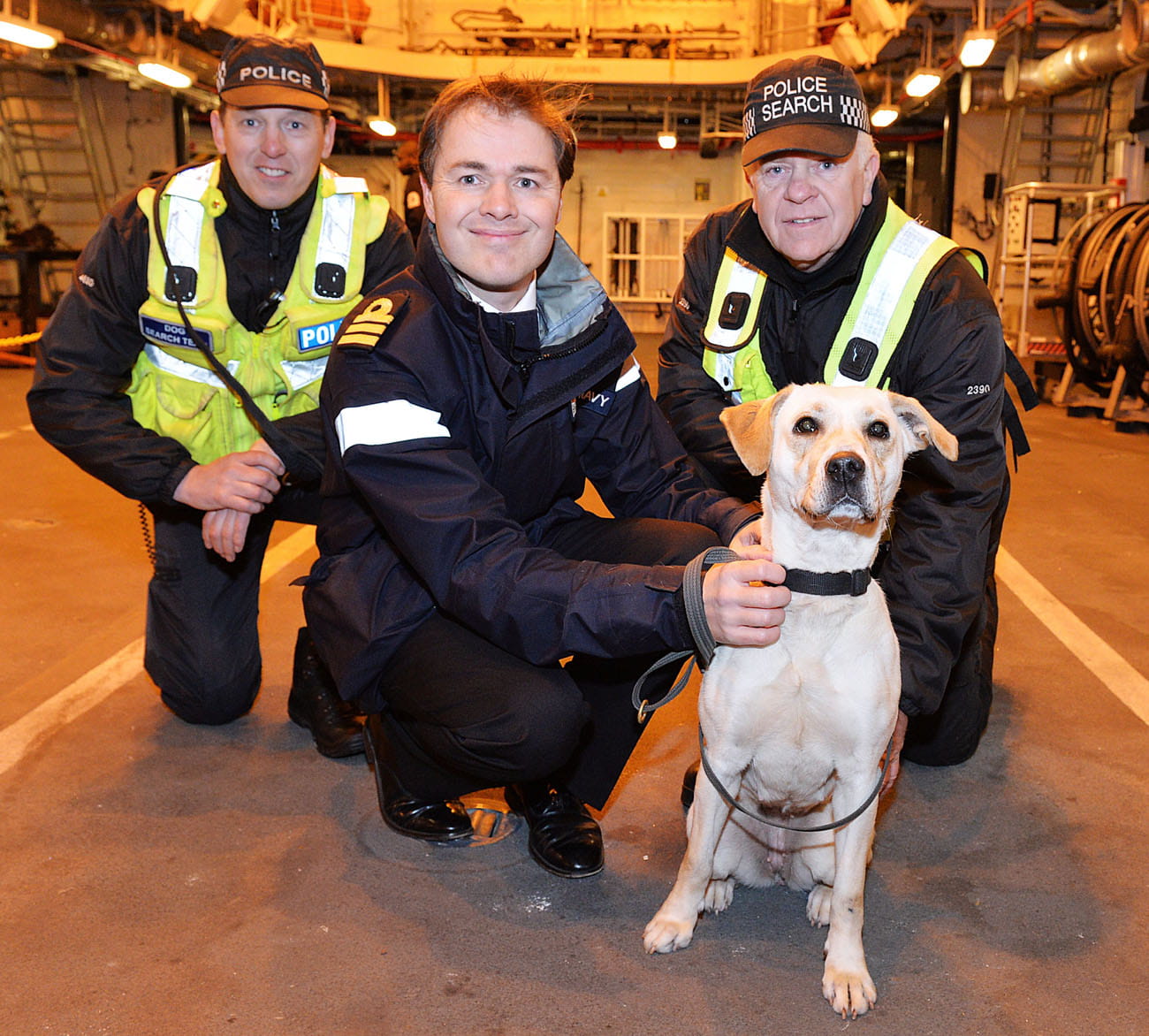 Drugs dogs practice following their nose on board warship