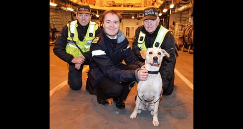 Drugs dogs practice following their nose on board warship