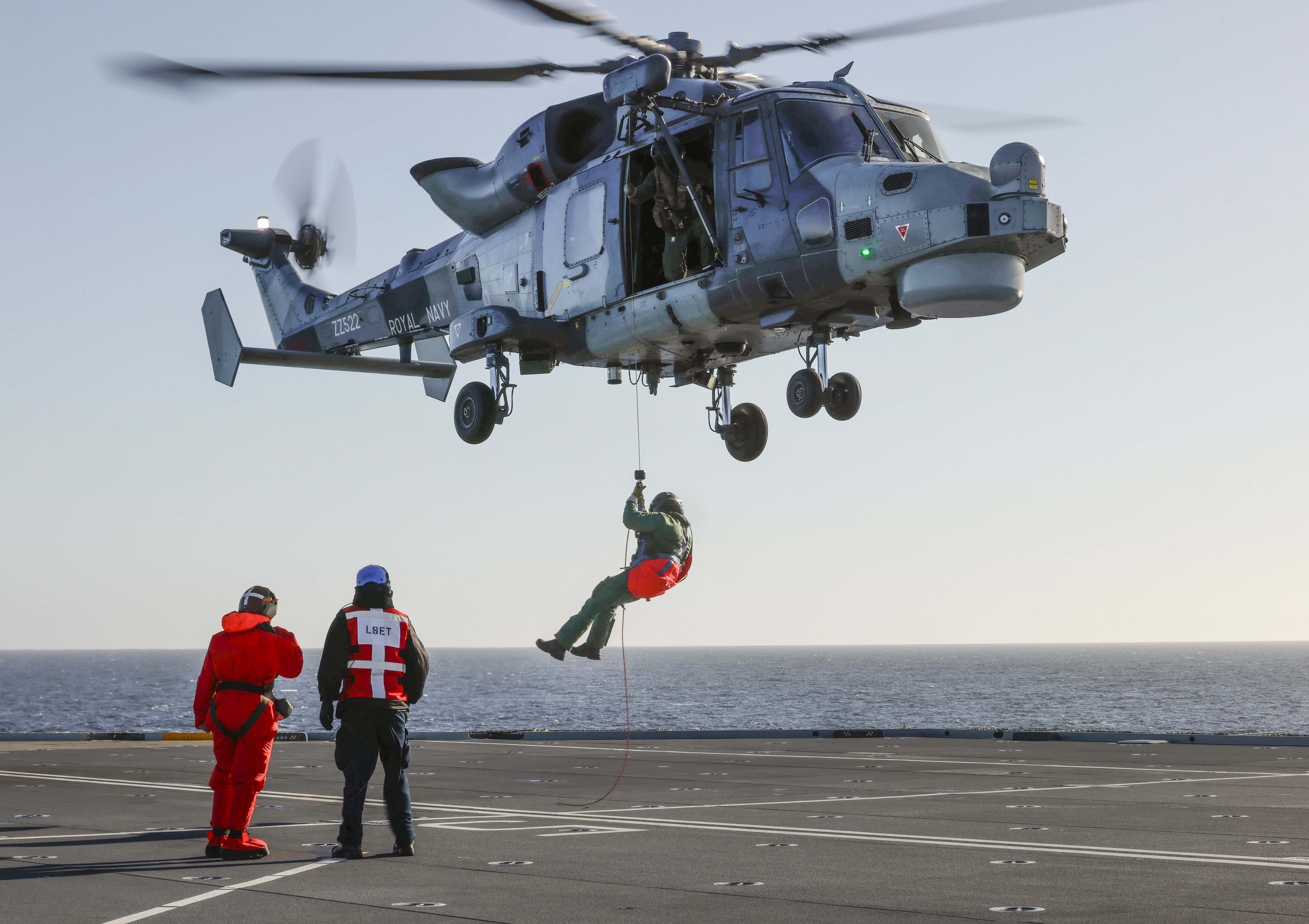 A Wildcat of 815 NAS conducts winching drills with HMS Prince of Wales