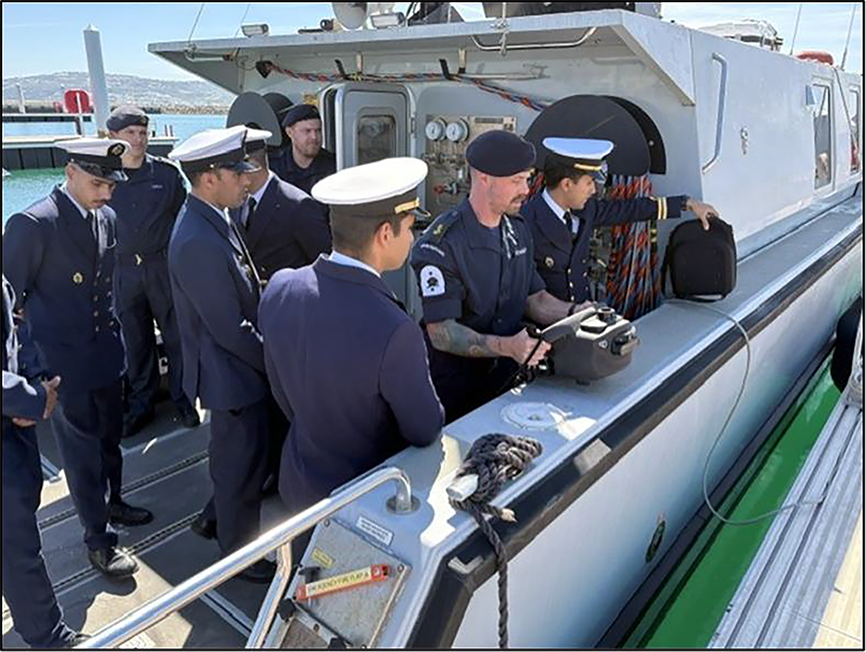Moroccan Clearance Divers onboard DSB for hand-held sonar capability brief