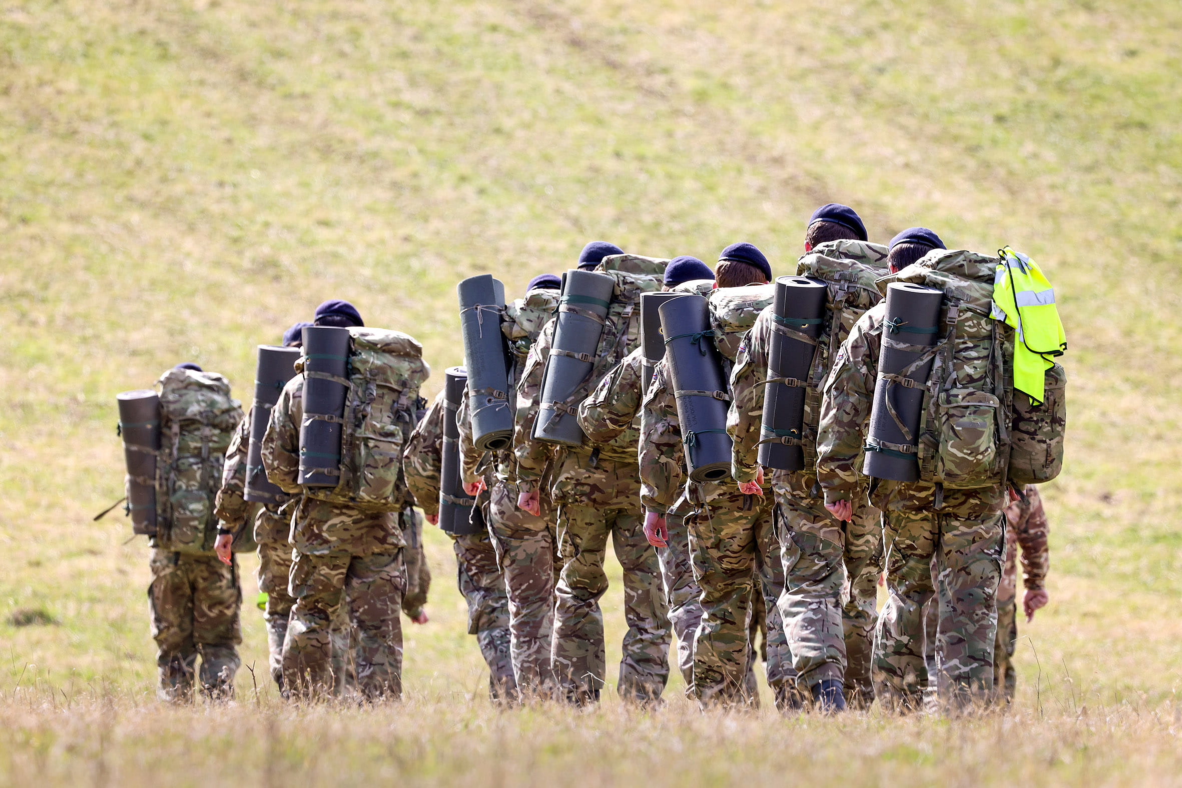 The recruits march through a field outside Erlestoke