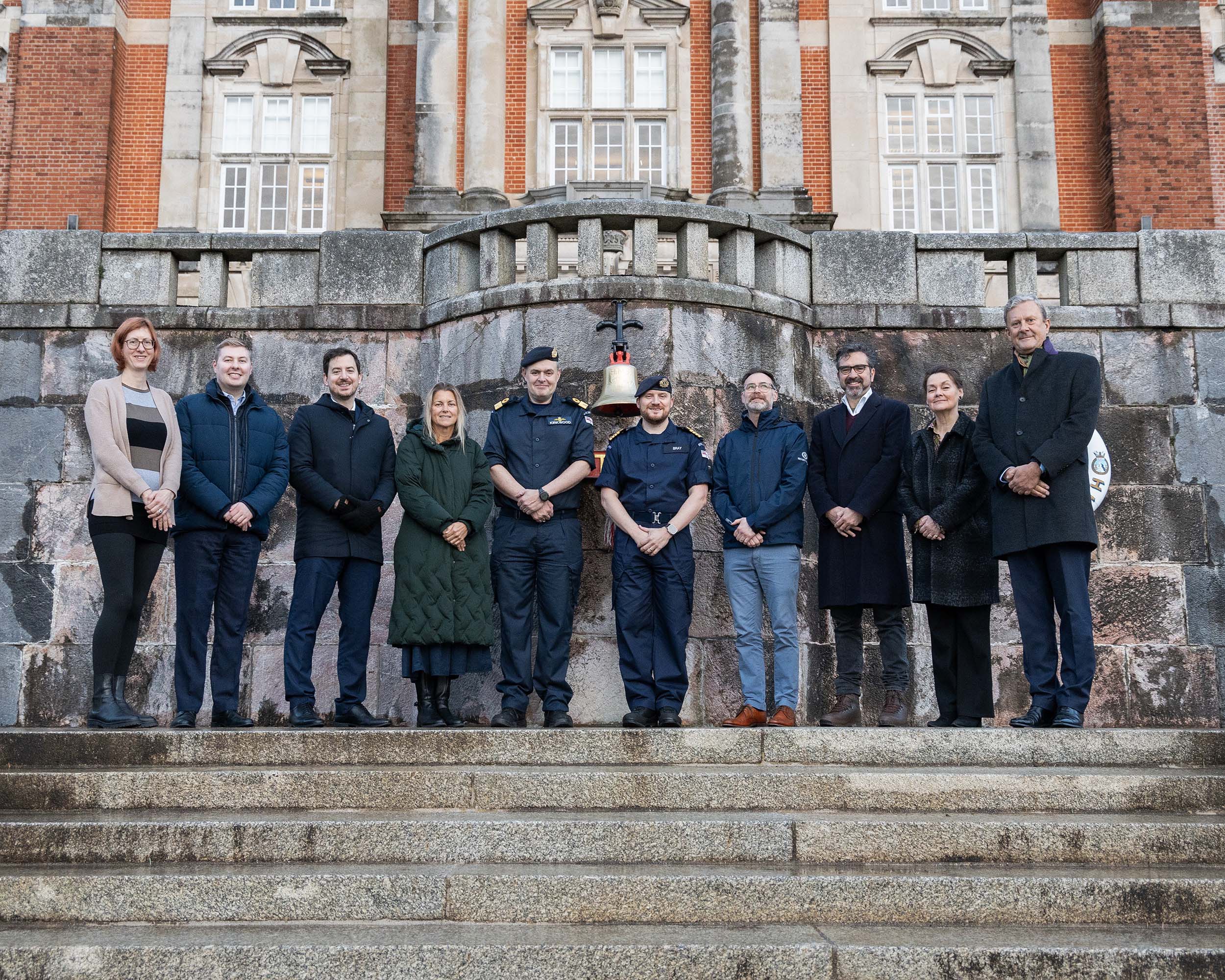 The Parliamentary VIPs with Cdre Kirkwood and BRNC's Captain Capt Andy Bray in front of the college