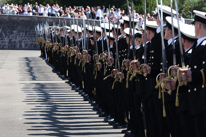 The passing out officers line up on the parade ground watched by loved ones