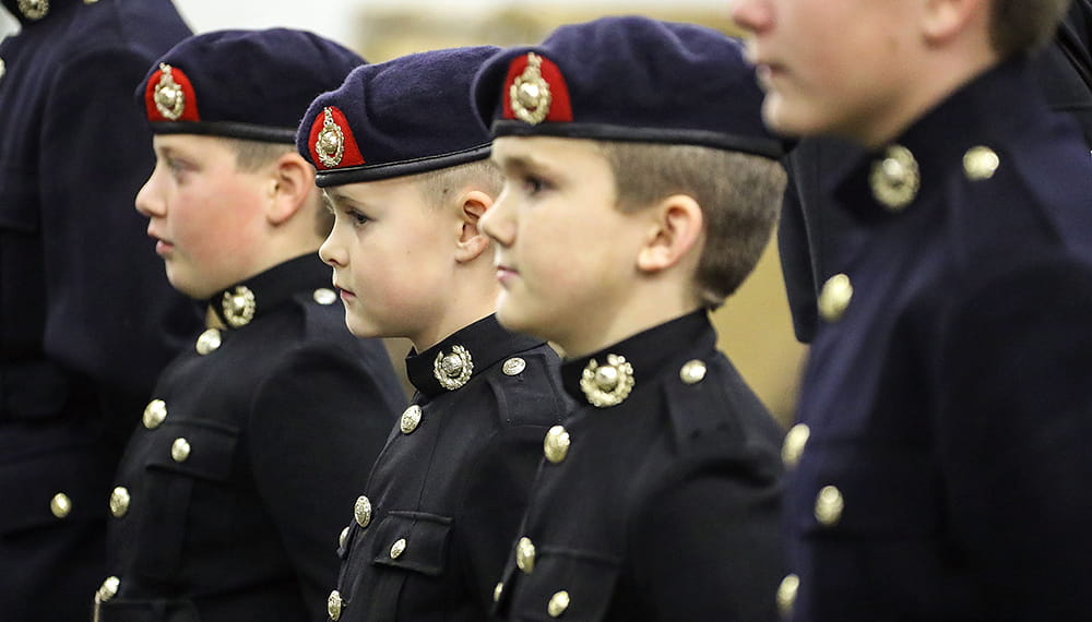 Royal-Navy-Organisation-cadets-and-youth-04-volunteer-cadet-corps.jpg Four Royal Navy cadets in black uniform