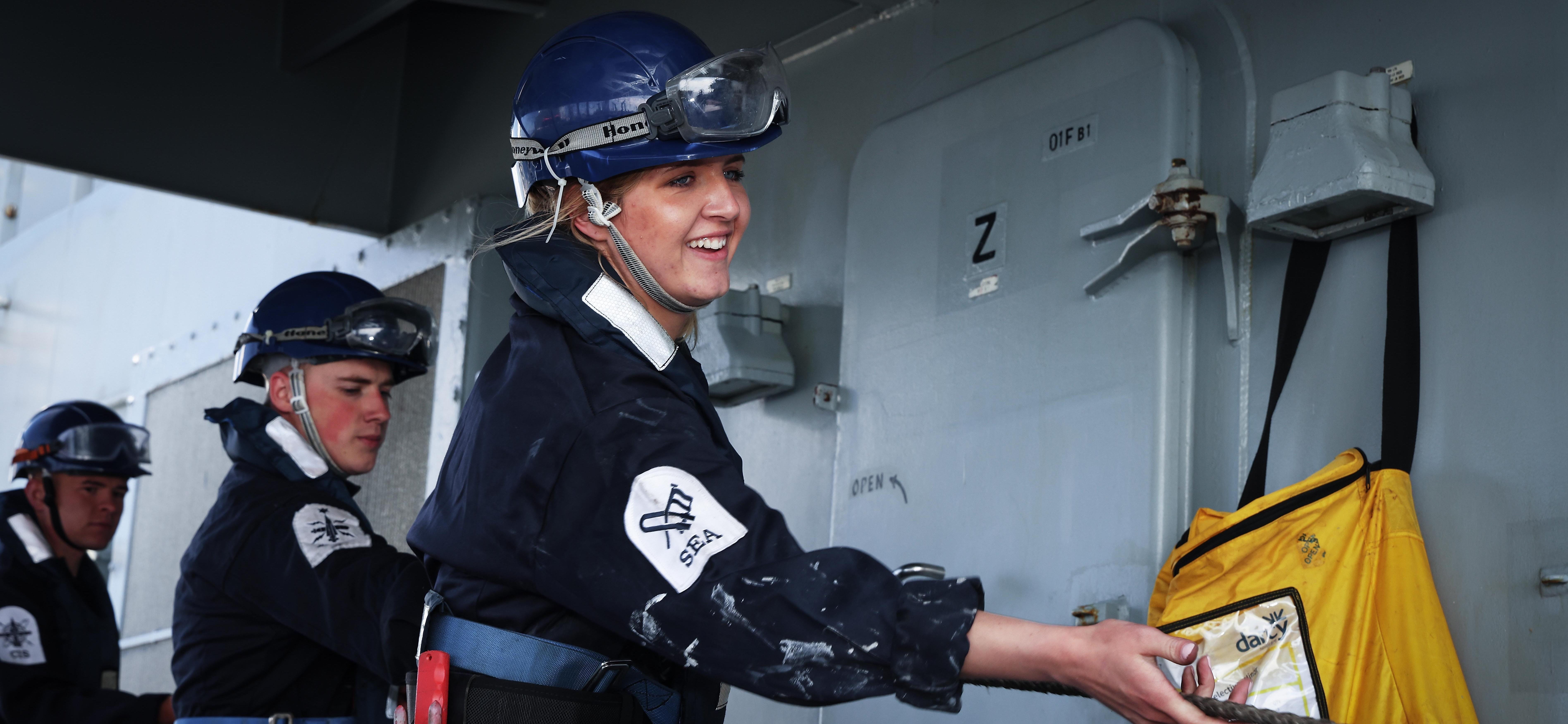 A Seaman Specialist from HMS Defender heaves in a line from USNS Patuxent during Replenishment at Sea during BALTOPS22.
