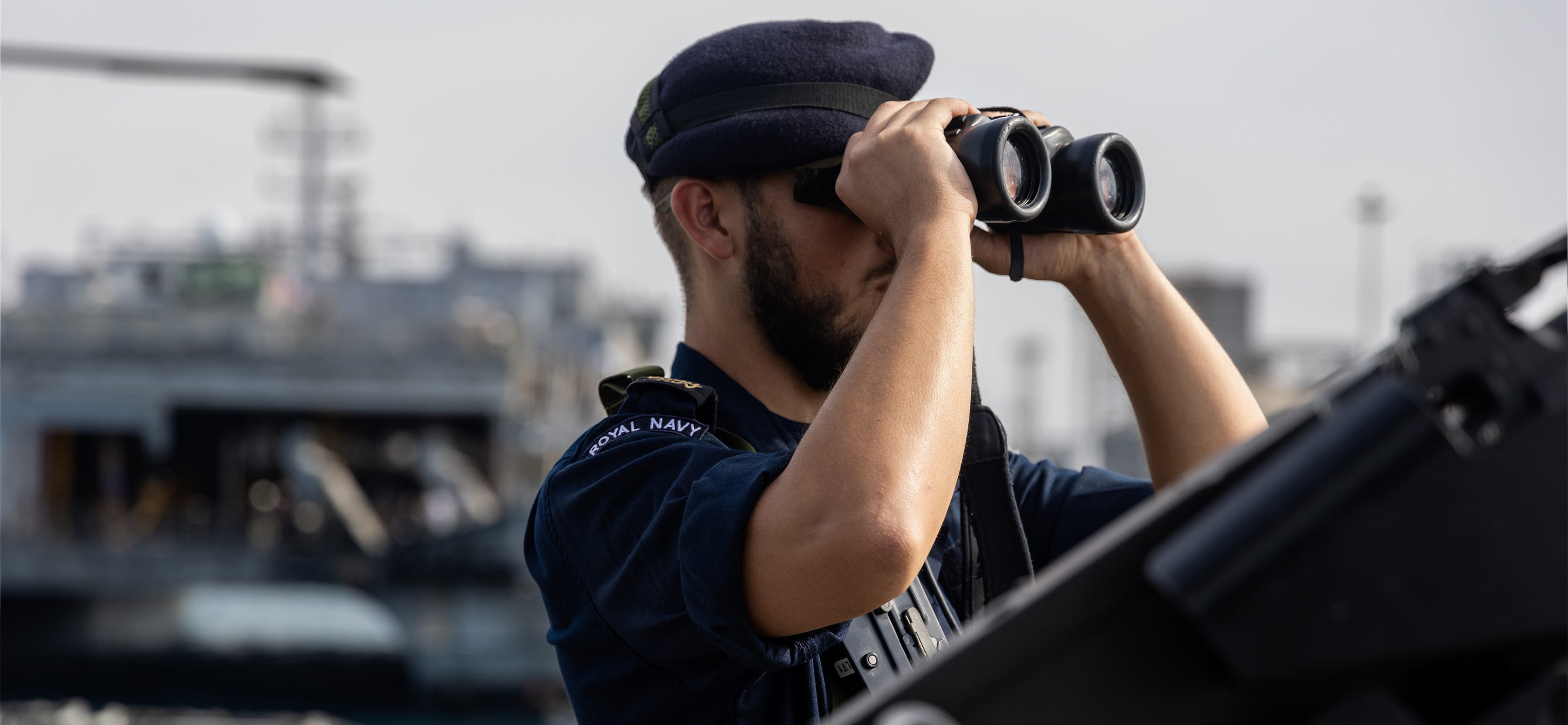 A SAILOR KEEPS WATCH ONBOARD HMS LANCASTER.