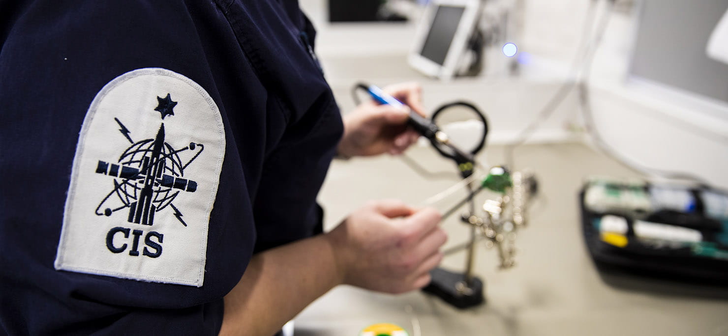 Engineering Technician Communications Information Systems (Weapons Engineer) Laura Suttle as she works to repair a telephone handset on board HMS Queen Elizabeth