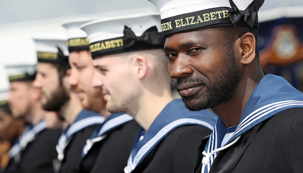 Royal-Navy-What-we-do-Respond-03-maintaining-excellence.jpg Royal Navy sailor smiles whilst on parade